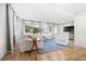 Cozy living room with hardwood floors, a plush sofa, and bright natural light at 2244 Glenmoor N Rd, Clearwater, FL 33764