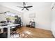 Bright office space with natural light, ceiling fan, and wood-look laminate flooring at 2244 Glenmoor N Rd, Clearwater, FL 33764