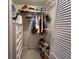 Walk-in closet with rods, shelves, and a dresser for optimal storage, as well as a mirrored door at 2250 Sequoia Dr, Clearwater, FL 33763