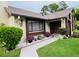 Charming home featuring a decorative lizard accent, framed by lush greenery and a well-manicured lawn at 2250 Sequoia Dr, Clearwater, FL 33763