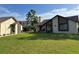 Charming home with a manicured lawn and exterior with attractive architectural features at 2250 Sequoia Dr, Clearwater, FL 33763