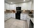 Bright kitchen featuring modern appliances, granite countertops, and ample cabinet space at 2250 Sequoia Dr, Clearwater, FL 33763