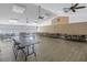 Large room with many tables and chairs, as well as ceiling fans and large windows at 2250 Sequoia Dr, Clearwater, FL 33763