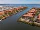Stunning aerial view of waterfront homes with private boat docks, showcasing the community's prime coastal location at 2709 Via Cipriani # 522B, Clearwater, FL 33764