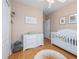 Bedroom with a crib, changing table and neutral colors give a peaceful, relaxing feeling at 2709 Via Cipriani # 522B, Clearwater, FL 33764