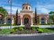 Elegant clubhouse exterior with manicured landscaping and stylish architecture at 2709 Via Cipriani # 522B, Clearwater, FL 33764