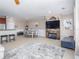 Open floor plan living room featuring fireplace, breakfast bar, dining area, and neutral paint at 2709 Via Cipriani # 522B, Clearwater, FL 33764