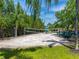 Community sand volleyball court and playground surrounded by lush landscaping at 2709 Via Cipriani # 522B, Clearwater, FL 33764