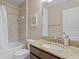 Bathroom with granite countertop, tile shower and tub at 2935 Winglewood Cir, Lutz, FL 33558