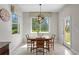 This formal dining room features a chandelier, natural light, and neutral paint to highlight the space at 2935 Winglewood Cir, Lutz, FL 33558