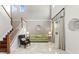 Elegant living room with two-story ceilings, marble floors, and staircase at 2935 Winglewood Cir, Lutz, FL 33558