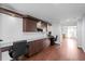 Large home office area includes built-in cabinetry and multiple work stations at 2935 Winglewood Cir, Lutz, FL 33558