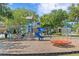 Community playground featuring slides, swings, and other fun equipment for outdoor play at 2935 Winglewood Cir, Lutz, FL 33558