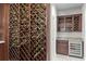 This home features a custom wine cellar with ample storage and a built-in cooler for the discerning wine enthusiast at 2935 Winglewood Cir, Lutz, FL 33558