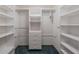 Walk-in closet with white shelving and organizers at 301 Caloosa Palms Ct, Sun City Center, FL 33573