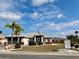 Charming single-story home featuring well-maintained landscaping and an American flag at 301 Caloosa Palms Ct, Sun City Center, FL 33573