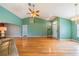 Spacious living area with hardwood floors, vaulted ceilings, and a view of the front entrance at 301 Caloosa Palms Ct, Sun City Center, FL 33573