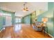 Expansive living space boasting hardwood floors, high ceilings, and a comfortable seating area at 301 Caloosa Palms Ct, Sun City Center, FL 33573