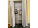 Walk-in kitchen pantry with wire shelving for organized storage of food items at 301 Caloosa Palms Ct, Sun City Center, FL 33573