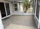 Screened patio, with tile flooring, offering a serene outdoor living space at 301 Caloosa Palms Ct, Sun City Center, FL 33573