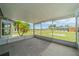 Spacious screened-in porch offering expansive backyard views at 301 Caloosa Palms Ct, Sun City Center, FL 33573