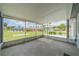 Screened-in porch with an open view of the neighborhood at 301 Caloosa Palms Ct, Sun City Center, FL 33573