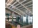 Indoor swimming pool with clean water, marked lanes, and large windows providing natural light at 301 Caloosa Palms Ct, Sun City Center, FL 33573
