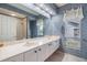Bathroom features a large vanity with dual sinks and a shower at 3136 Sandhill Dr, Holiday, FL 34691