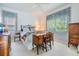 Cozy bedroom featuring natural light, furniture, and a comfortable quilt-covered bed at 3136 Sandhill Dr, Holiday, FL 34691