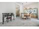 Formal dining room with elegant chandelier, mirrored wall, display cabinet, and seating for sophisticated dining at 3136 Sandhill Dr, Holiday, FL 34691