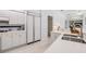 Contemporary kitchen with white cabinets, stainless steel appliances, and sleek countertops for a clean, modern look at 3136 Sandhill Dr, Holiday, FL 34691