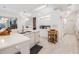 Bright and spacious kitchen with white cabinetry, modern appliances, and a view to the breakfast nook at 3136 Sandhill Dr, Holiday, FL 34691