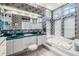 Spacious main bathroom with dual sinks, soaking tub, and lots of natural light at 3136 Sandhill Dr, Holiday, FL 34691