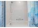 Bright bathroom shower with clean white tile and modern showerhead at 3136 Sandhill Dr, Holiday, FL 34691