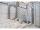 Modern bathroom with a glass shower and patterned wallpaper at 3136 Sandhill Dr, Holiday, FL 34691
