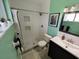 Modern bathroom with tiled shower, decorative accents, and sleek vanity at 3339 Avanti Cir, North Port, FL 34287