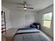 Bedroom with a comfortable armchair, closet, and window with a view at 3339 Avanti Cir, North Port, FL 34287