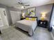 Bright bedroom with a ceiling fan and double closet, featuring a comfortable queen-sized bed at 3339 Avanti Cir, North Port, FL 34287