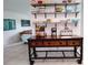 Dining area featuring open shelving with decorative dishware at 3339 Avanti Cir, North Port, FL 34287