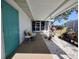 Covered patio with stylish seating, lush potted plants, and a serene atmosphere perfect for outdoor enjoyment at 3339 Avanti Cir, North Port, FL 34287
