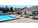 Exterior image showcases a pool with ample seating and a well-maintained patio area at 3339 Avanti Cir, North Port, FL 34287