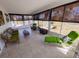 Relaxing sunroom with tile floors and large windows at 3339 Avanti Cir, North Port, FL 34287