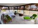 Relaxing sunroom with tile floors and large windows at 3339 Avanti Cir, North Port, FL 34287