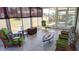 Relaxing sunroom with tile floors and large windows at 3339 Avanti Cir, North Port, FL 34287