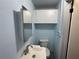 Powder room offers vanity with mirrored medicine cabinet, and built in cabinets at 3615 Kingsbury Dr, Holiday, FL 34691