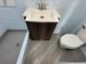 Bathroom featuring vanity with a sink, and a toilet at 3615 Kingsbury Dr, Holiday, FL 34691