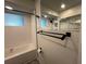 Bathroom showcases a tiled shower, black hardware, and modern fixtures at 3615 Kingsbury Dr, Holiday, FL 34691