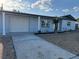 Charming single-story home with a well-maintained lawn, blue paint, a one car garage, and a concrete driveway at 3615 Kingsbury Dr, Holiday, FL 34691