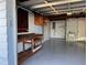 Well-organized garage with a workbench, pegboard, and plenty of storage space at 3615 Kingsbury Dr, Holiday, FL 34691