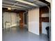 Organized garage interior featuring utility sink and shelving for storage needs at 3615 Kingsbury Dr, Holiday, FL 34691
